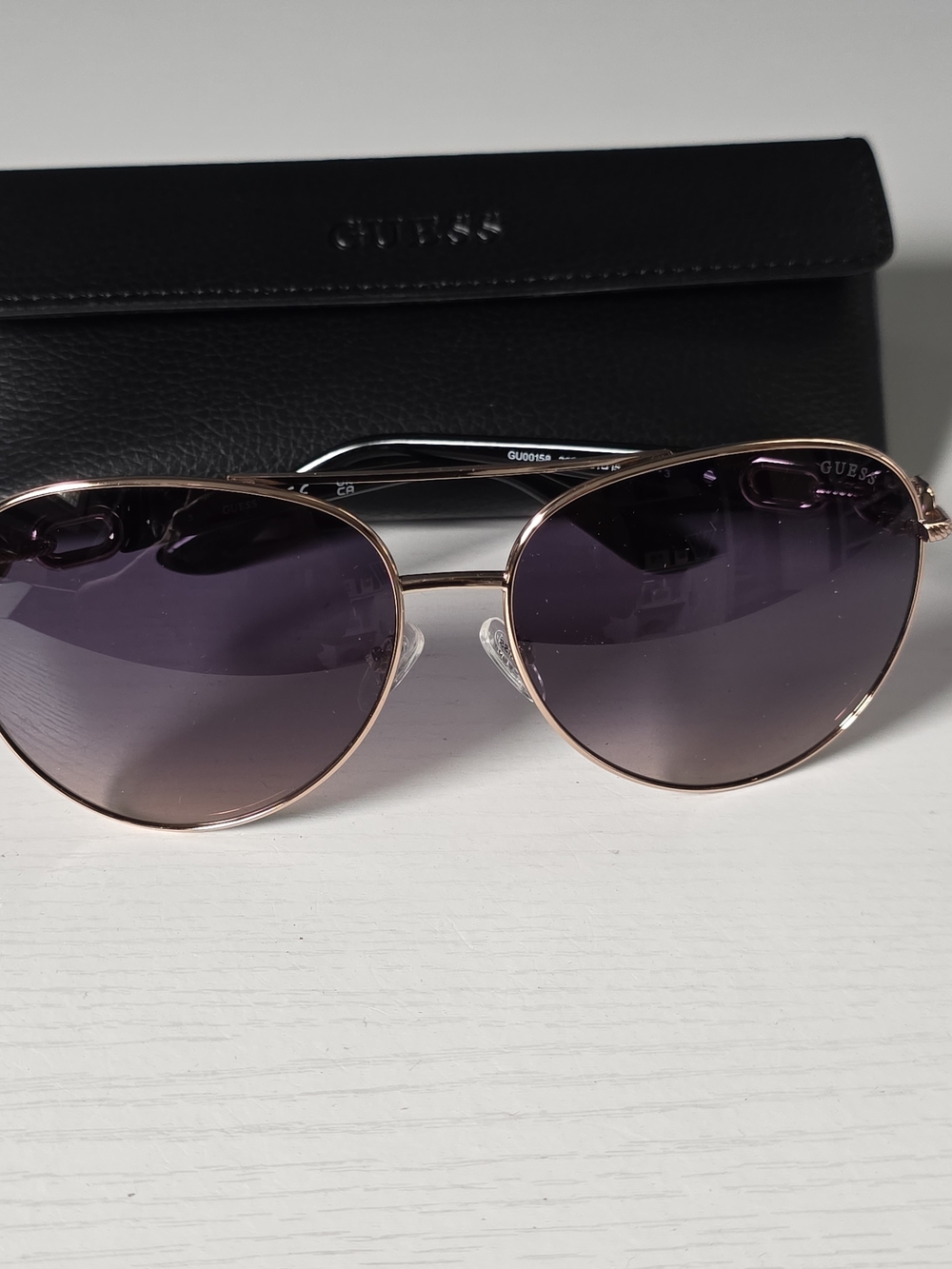 GUESS Rose Gold Frame Sunglasses with Purple Lenses